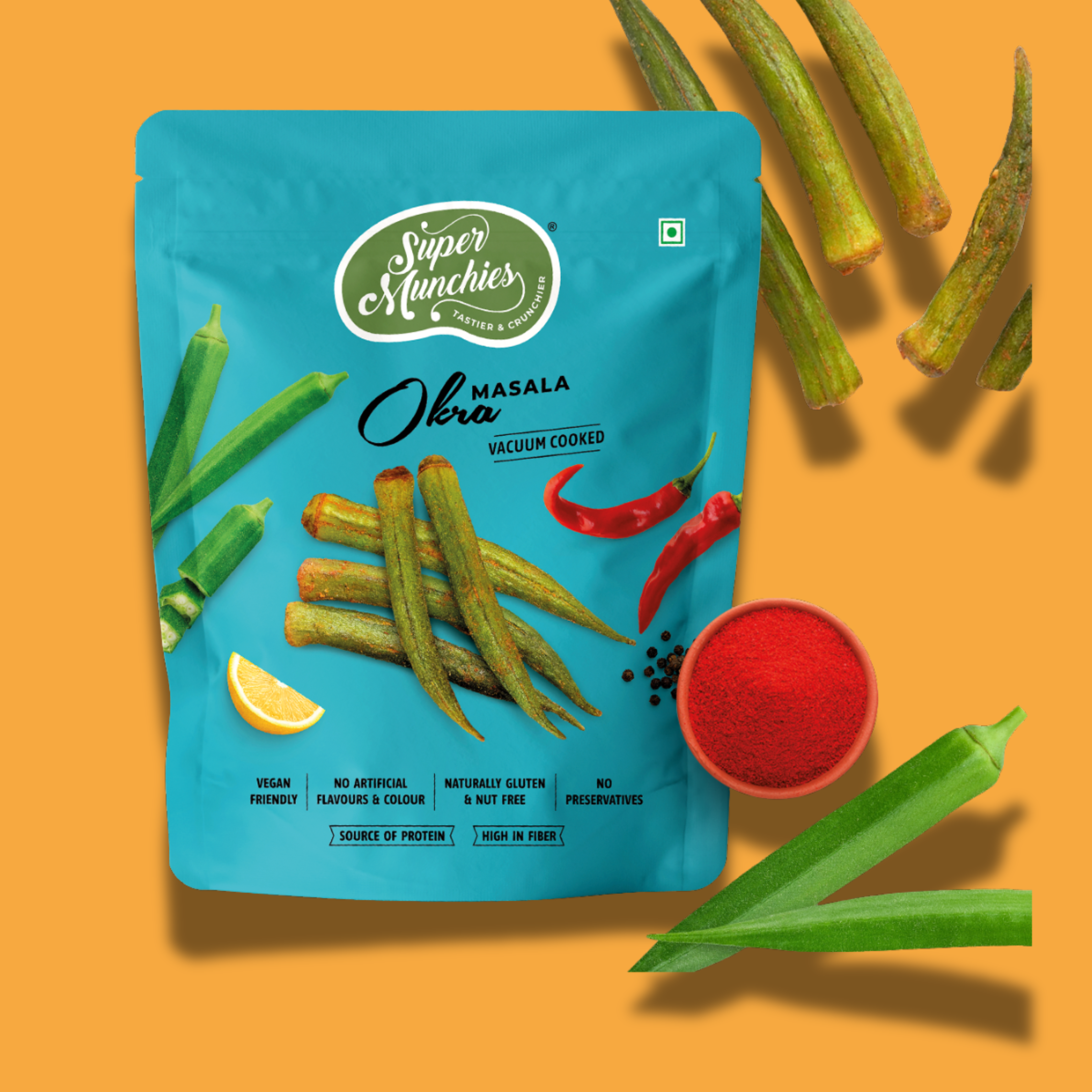 Super Munchies Masala Okra vacuum-cooked veggie chips snack pack with okra, red chili and spices on orange background